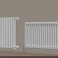 White Wall Mounted Heating Radiators Against Light Wall With Wooden Floor
