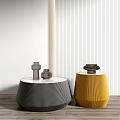 Modern Black And Yellow Coffee Tables With Textured Surfaces And Decorative Items On Wooden Floor