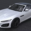White Jaguar Convertible Sports Car With Black Top And Sleek Exterior Design