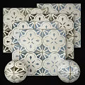 Blue and White Floor Tiles with Geometric Floral Patterns in Vintage Mediterranean Style