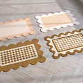 Stylish Decorative Rugs With Scalloped Edges And Checkerboard Patterns On Wooden Floor