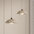 Beige Scalloped Pendant Lights With Wooden Details And Metal Chains Hanging By Light Colored Wall