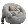 Plush Gray Round Bean Bag Chair With Geometric Patterned Pillow And Soft Blanket