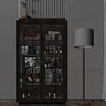 Dark Wooden Wine Cabinet With Glass Doors Holding Bottles And Decorative Items Beside Floor Lamp