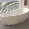 White Freestanding Bathtub With Faucet And Light Colored Towel By Window With Blinds
