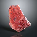 Natural Red Stone With Purple Specks And Rough Textured Surface For Decorative Use