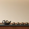 Minimalist Traditional Tea Set With Black Teapot And Four Teacups On Wooden Tray