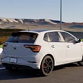 White Volkswagen Golf GTI 5 Door Hatchback With Sporty Design On Mountain Road