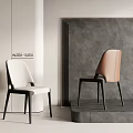 Wabi Sabi Style Dining Chairs With Cream And Brown Upholstery And Black Slim Legs