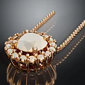 Elegant Gold Necklace With Large Center Gemstone And Surrounding Small Stones