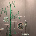 Unique Photo Spot Featuring Green Metal Tree Design White Trays Circular Yin Yang Decor