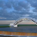 Modern Arch Bridge With White Railings Over Water Under Cloudy Sunset Sky