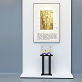 Glass Display Cabinet with Black Frame Blue Fabric Base Showcasing Two Exhibits Under Spotlights
