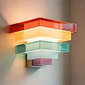 Colorful Layered Transparent Glass Wall Lamp Mounted On Wall With Vibrant Gradient Colors Illuminating Interior