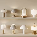 Various Stylish Table Lamps Displayed On Shelves With Different Designs