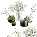 Stylish Glass and Dark Vases with White Small Flowers and Decorative Green Twigs