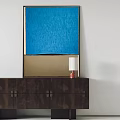 Abstract Blue and Brown Painting Wall Hanging with Dark Cabinet and White Lampshade Lamp