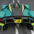 Turquoise Supercar with Sleek Aerodynamic Design and Yellow Accents Cruising on Highway