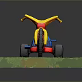 Kids Tricycle with Yellow Handlebars Red Body Blue Seat Black Wheels on Green Grass