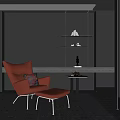 Stylish Orange Accent Chair With Ottoman Decorative Pillow And Side Table Against Dark Wall With Floating Shelves