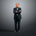 A Man in Dark Suit Standing with Arms Crossed Against Gray Gradient Background