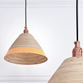 Wooden Pendant Lights with Conical Shades Orange Trim Copper Bases Against White Wall Background