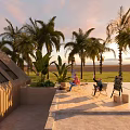 Outdoor Terrace With Palm Trees Sunset View People Relaxing Near Wooden Building