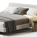 Modern Double Bed With Gray Blanket White Pillows And Wooden Side Tables