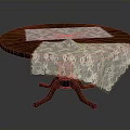 Elegant Round Wooden Dining Table With White Lace Tablecloths And Carved Pedestal Base