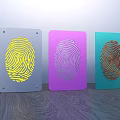 Colorful Decorative Ornament Set With Fingerprint Design In Yellow Purple Teal On Wooden Surface