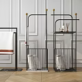 Modern Black Metal Bathroom Storage Shelves Featuring Gold Accents Towels and Toiletries