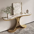 Golden Console Table with Artwork Vase with Plants and Decorative Jar Against Light Colored Wall