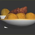 Fresh Purple and Yellow Sweet Potatoes in Square Bowl with Yellow Balls on Round Plate