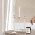 Elegant Decorative Ornament Set With Silver Candle Holders White Candles And Lit Match
