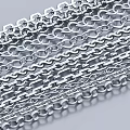 Multiple Shiny Silver Metal Chains With Various Link Designs Arranged Neatly