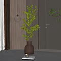 Brown Glass Vase With Green Leafy Branches In Modern Indoor Decor With Soft Lighting
