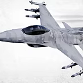 High Speed Gray Camouflage Fighter Jet Flying With Attached Missiles And Tail Flame