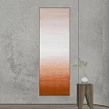 Long Vertical Decorative Painting With Orange Brown Gradient And Wooden Side Table With White Vase