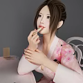 Woman in Cherry Blossom Kimono Applying Lipstick at Vanity Table with Mirror