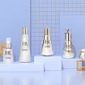 HR Cosmetics Display Featuring White Platforms Gold Decorations and Light Blue Background
