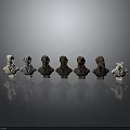 Graduated Color Bust Sculptures Arranged in a Row on Dark Background with Reflections