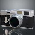 Vintage Camera With Silver And Black Body Large Lens On Gray Background