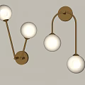 Modern Gold Metal Wall Lamps with White Globe Shades Mounted on Gray Wall