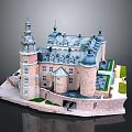 Historic Castle Architecture With Spired Towers Blue Roofs Stone Walls And Green Courtyard