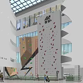 Indoor Rock Climbing Wall In Multi Story Building With Colorful Holds And Glass Windows