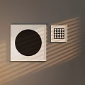 Abstract Paintings With Black Circle And Checkerboard Frames On Gray Wall With Light Shadows