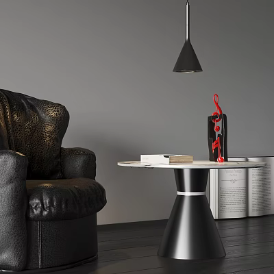 Stylish Modern Side Table with Red Decorative Item and Books by Black Leather Sofa 3d model