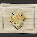 Golden Pastry Pieces Stacked On Wooden Cutting Board For Serving