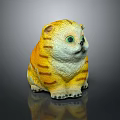 Yellow Orange Striped Cat Plush Toy With Green Eyes Sitting On Black Background With Reflection