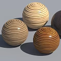 Layered Wooden Spheres In Different Wood Tones And Textures On